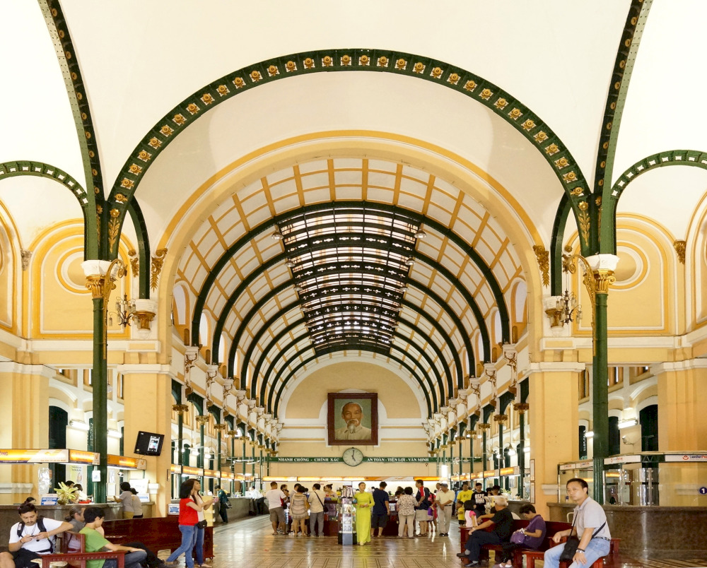Visitors are immediately captivated by its high barrel-vaulted ceiling, elegantly supported by intricate ironwork columns 
